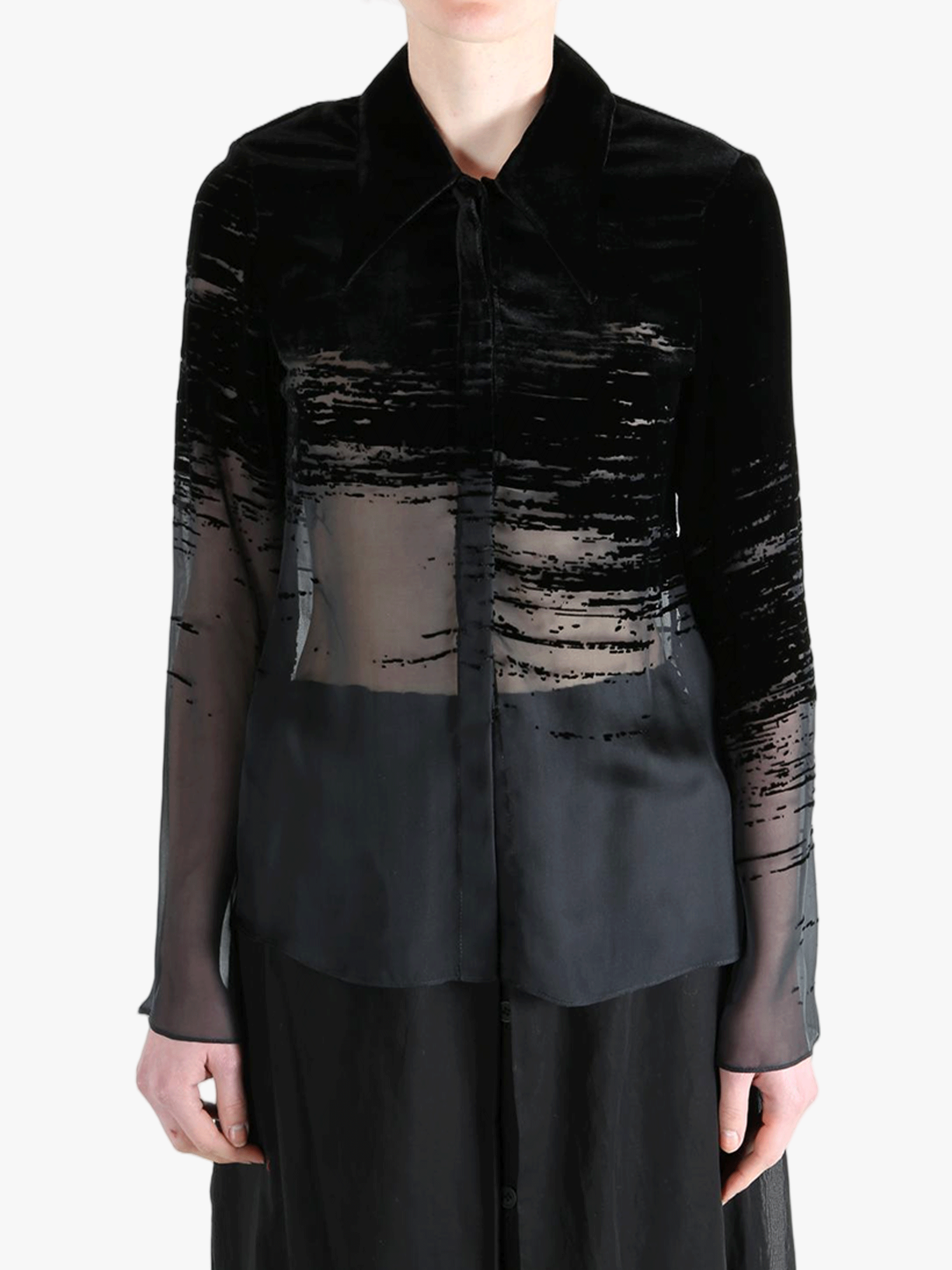 Black shirt worn by a person, showing the shirt fit