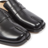 Close up of black shoes,showing texture of the leather fabric.