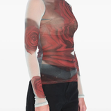 White top worn by a person, showing the top's fit