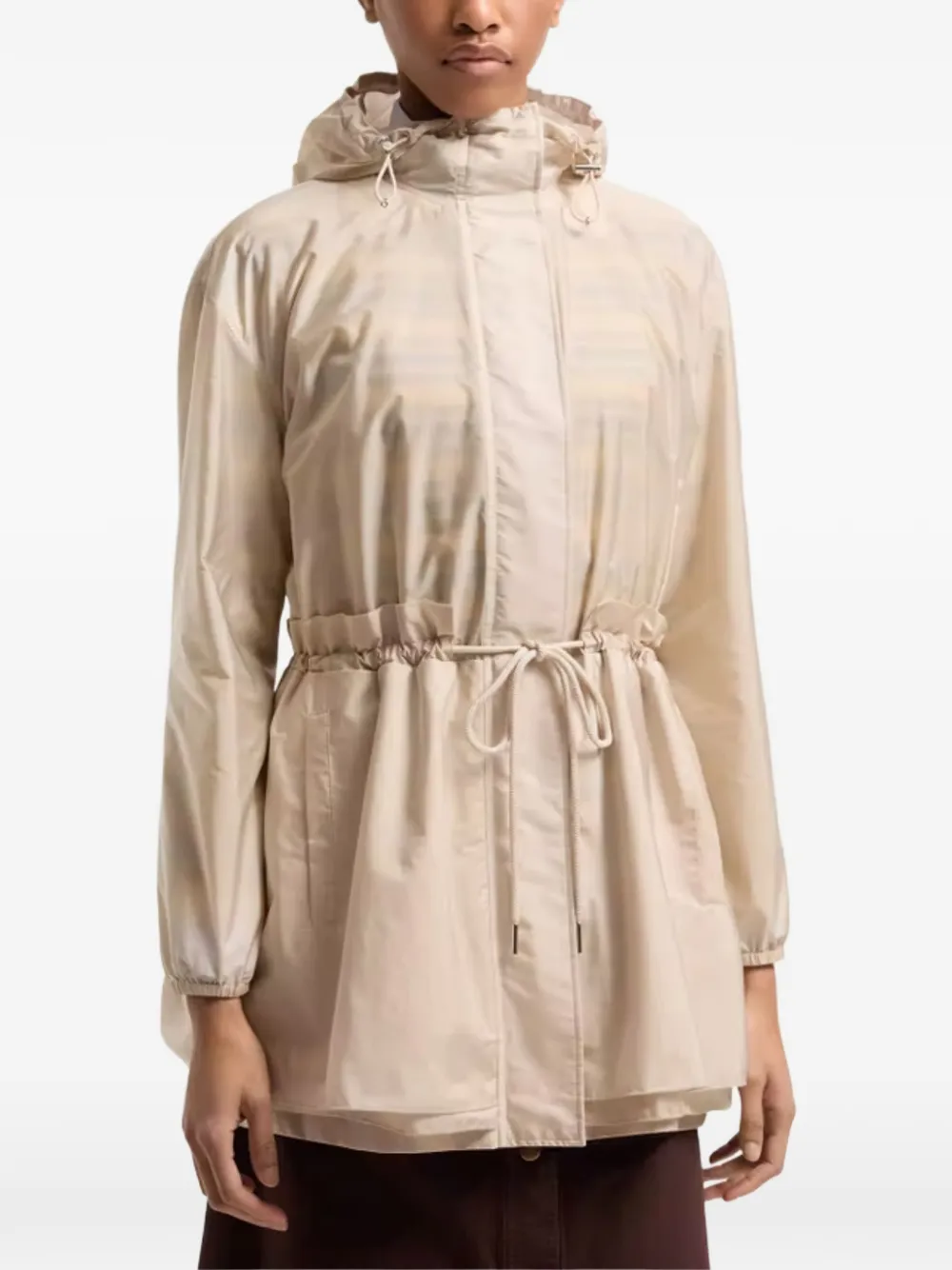 tan jackets-coat worn by a person, showing the jackets-coat's fit