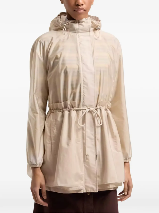 tan jackets-coat worn by a person, showing the jackets-coat's fit
