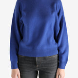 blue sweater worn by a person, showing the sweater fit