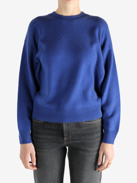 blue sweater worn by a person, showing the sweater fit