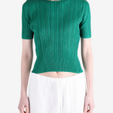 Green shirt worn by a person, showing the shirt fit