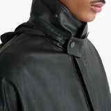 Close up of the black jacket, showing texture of the leather fabric