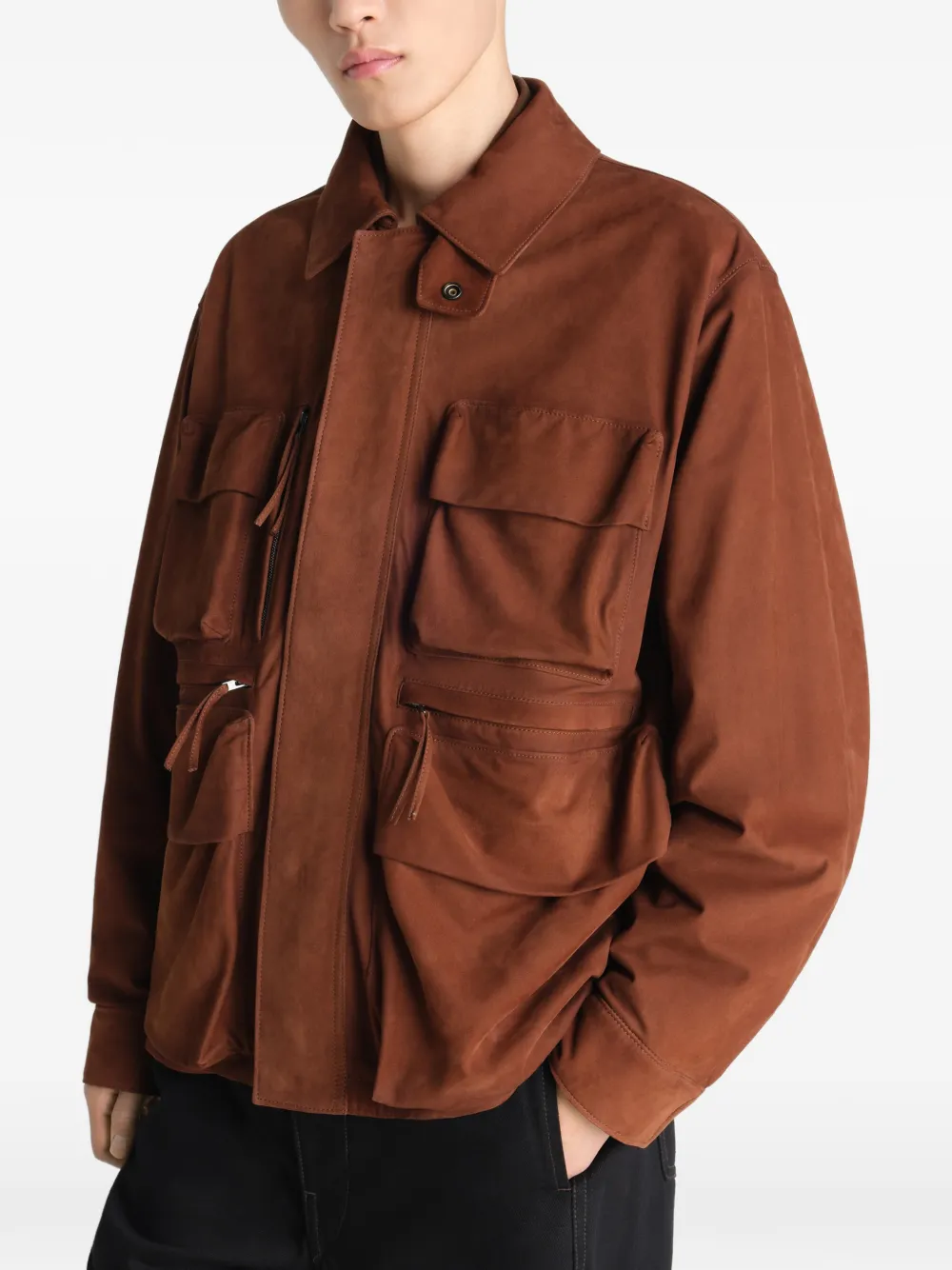 Brown jackets-coats worn by a person, showing the jackets-coats's fit