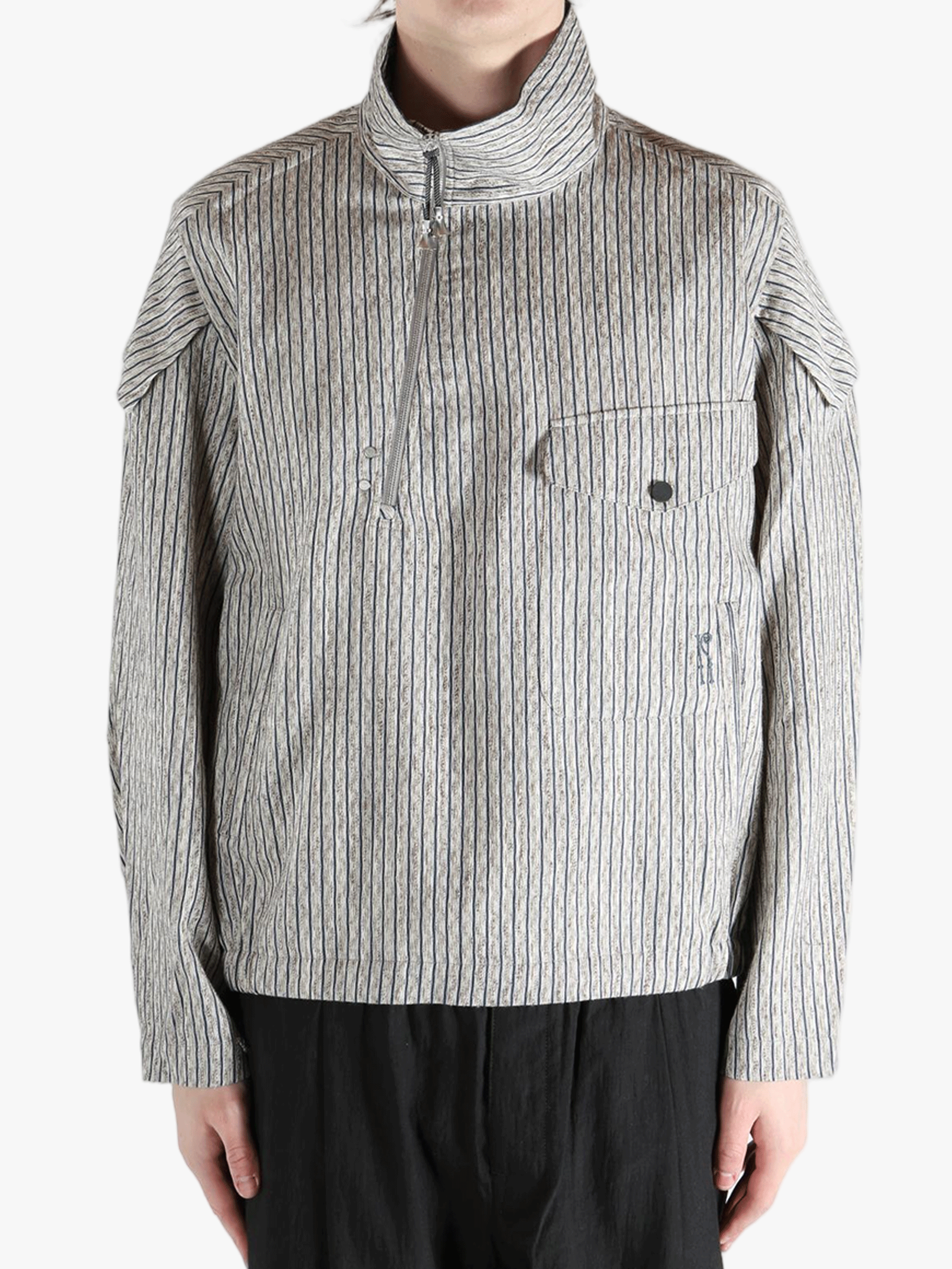 Grey jackets-coats worn by a person, showing the jackets-coats's fit