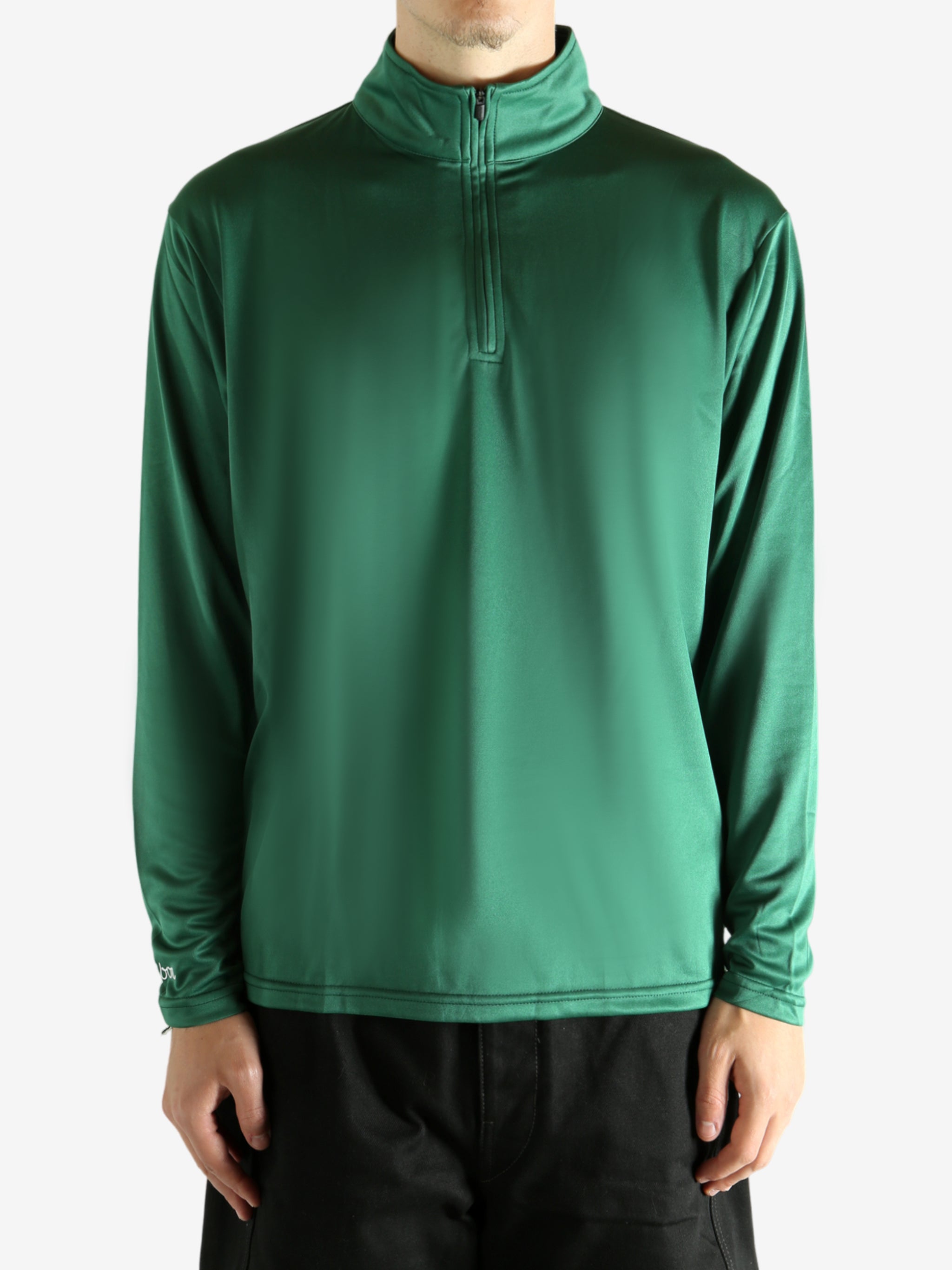 Green pullover worn by a person, showing the pullover's fit