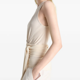 Tan top worn by a person, showing the top fit