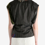 Brown top worn by a person, showing the top fit