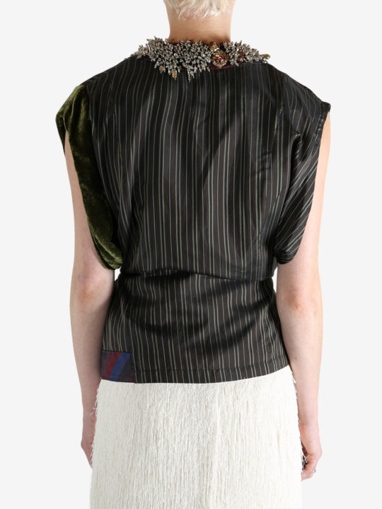 Brown top worn by a person, showing the top fit