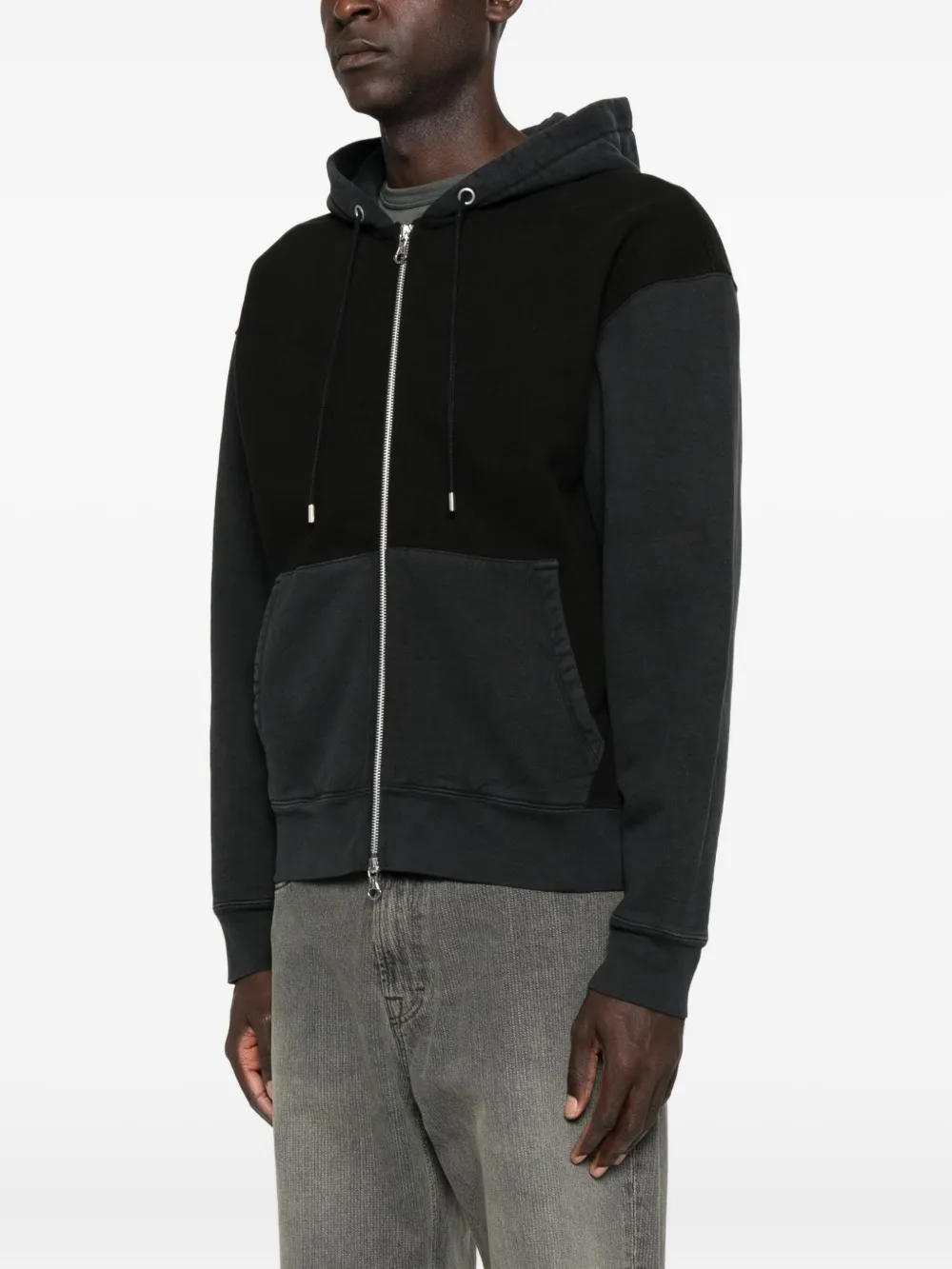 Black hoodie worn by a person, showing the hoodie fit