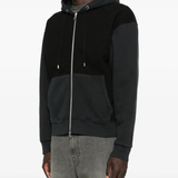 Black hoodie worn by a person, showing the hoodie fit