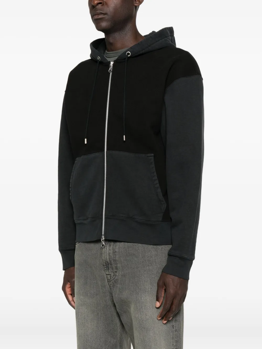 Black hoodie worn by a person, showing the hoodie fit