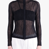 Black shirt worn by a person, showing the shirt fit