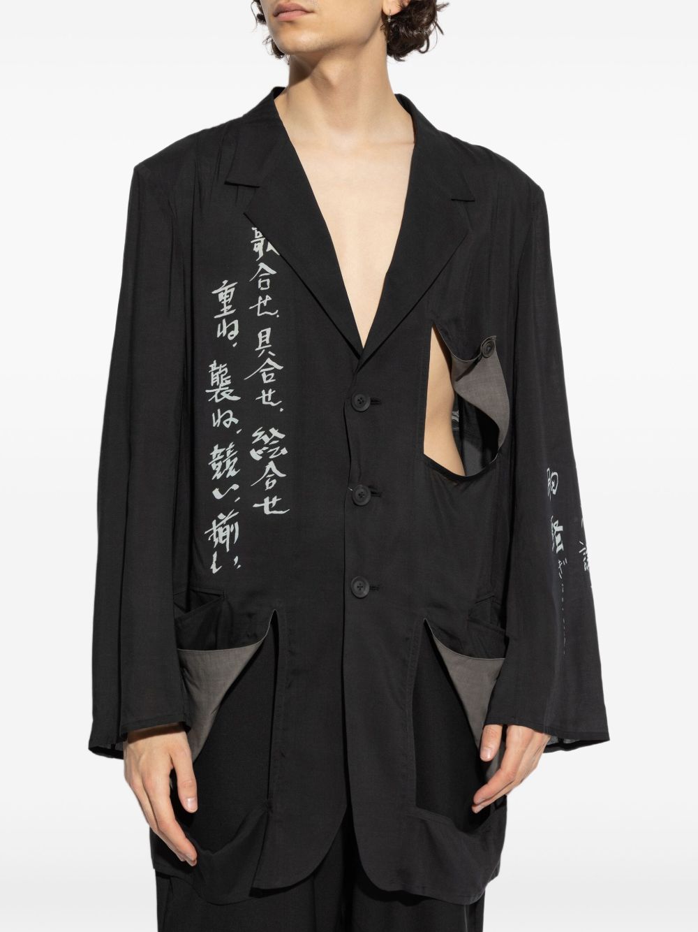 Black jacket worn by a person, showing the jacket's fit