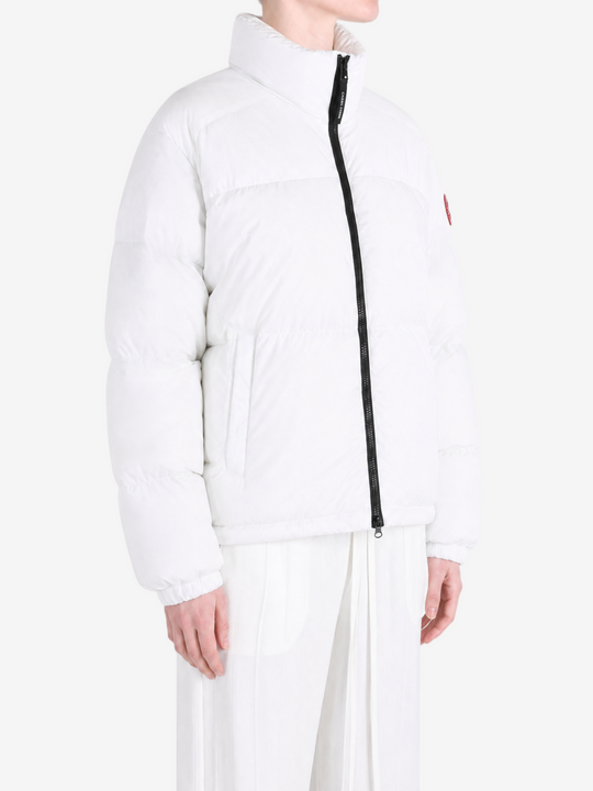 White jacket worn by a person, showing the jacket fit