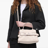 White bag worn by a person, showing the bag's fit