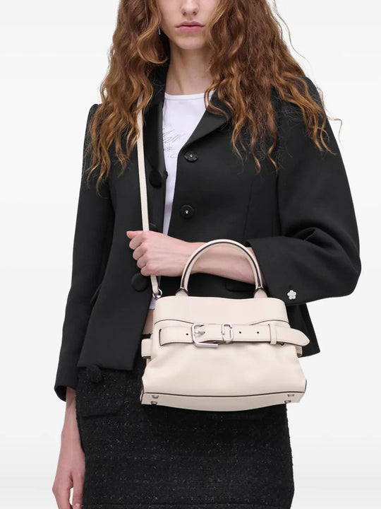 White bag worn by a person, showing the bag's fit