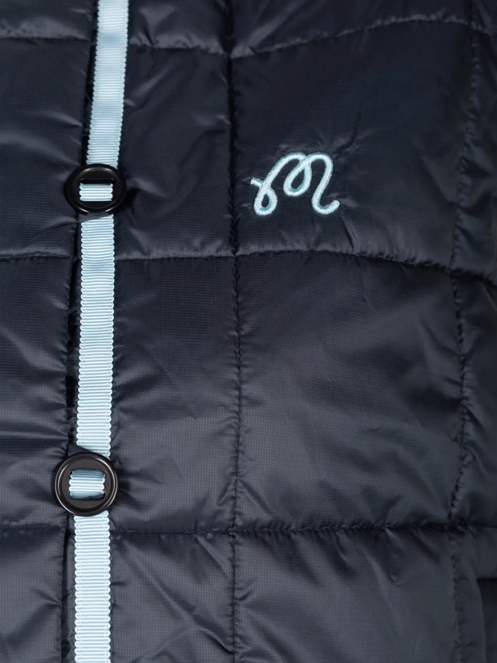 Close up of Navy jacket, showing texture of the 100% recycled polyester made fabric