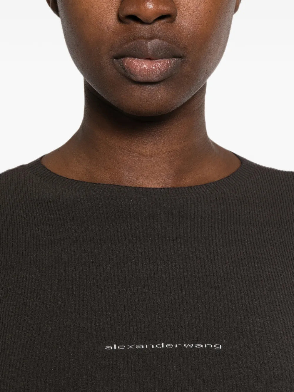 Black t-shirt worn by a person, showing the t-shirt fit