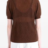 Brown shirt worn by a person, showing the shirt fit