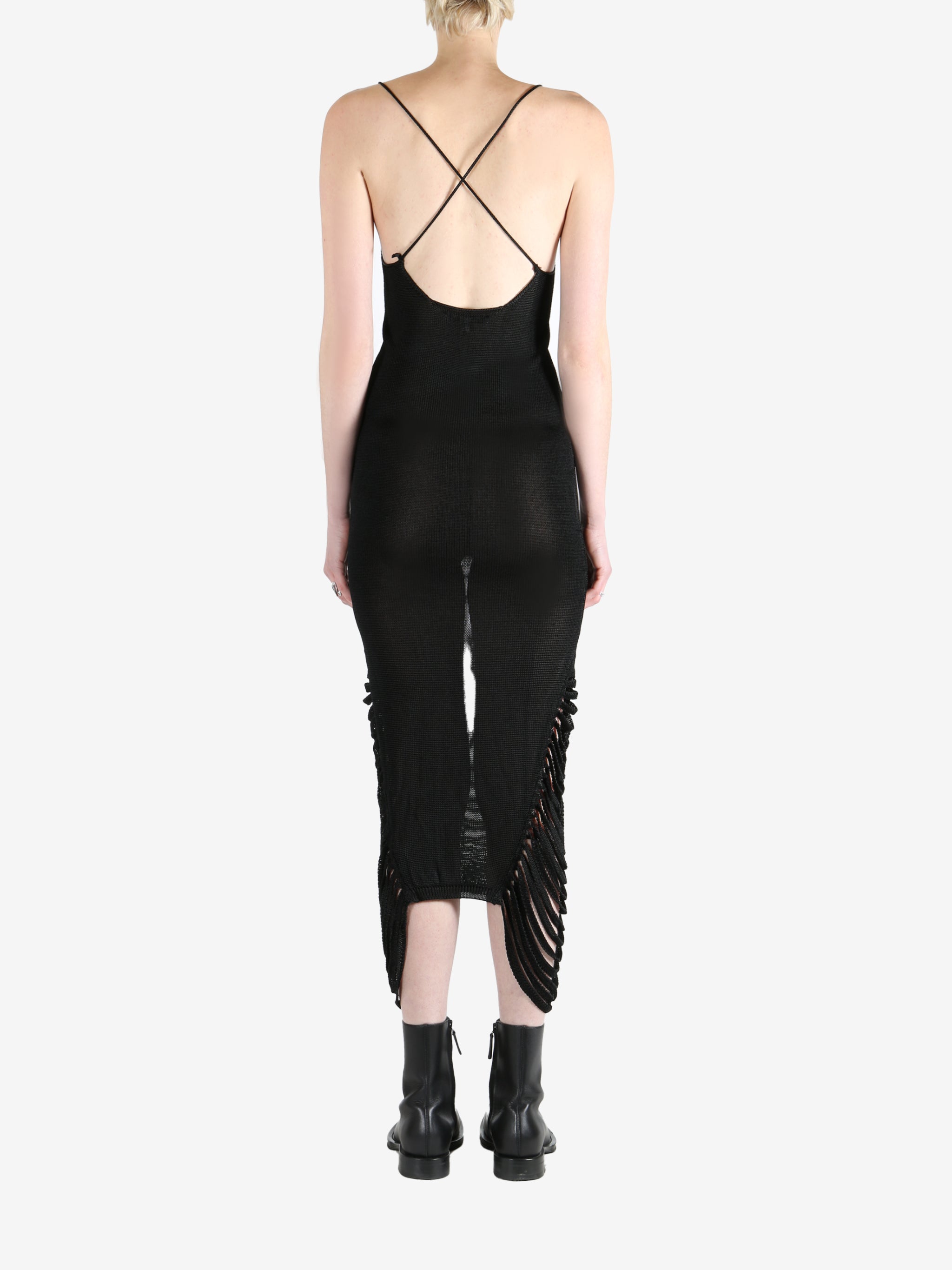 Black dresses worn by a person, showing the dresses fit