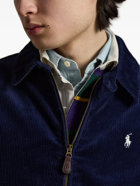 Close up of the blue jacket, showing  texture of the cotton