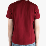 Red shirt worn by a person, showing the fit