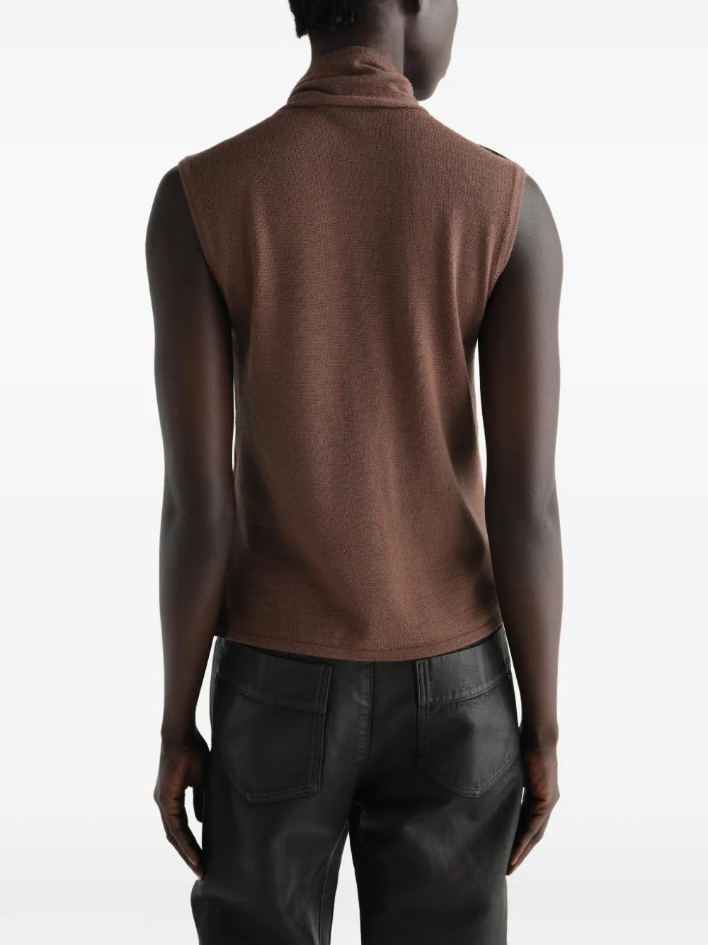 Brown top worn by a person, showing the top fit