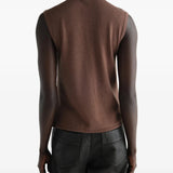 Brown top worn by a person, showing the top fit