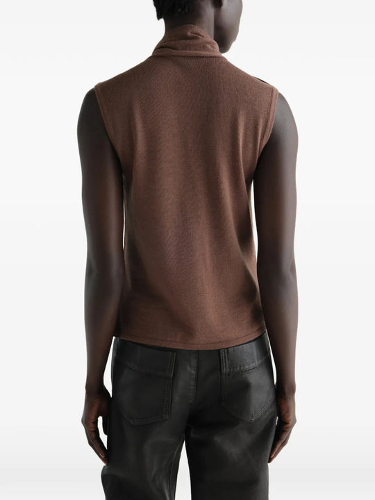 Brown top worn by a person, showing the top fit