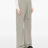 Grey pants worn by a person, showing the pants' fit