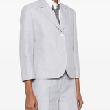 Grey jacket worn by a person, showing the jacket fit