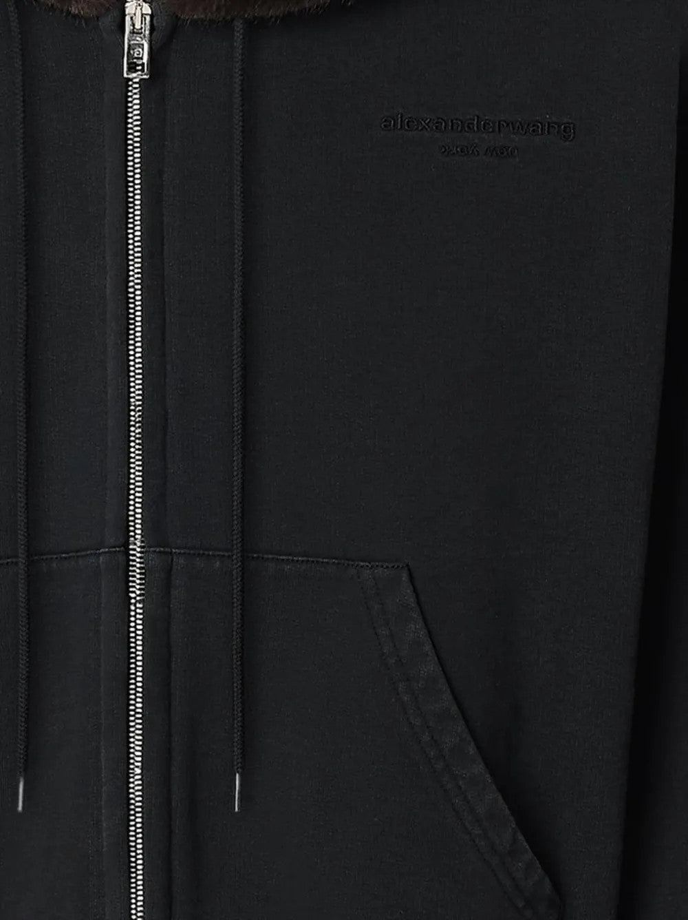 Close up of Black hoodie, showing texture of the 100% cotton fabric