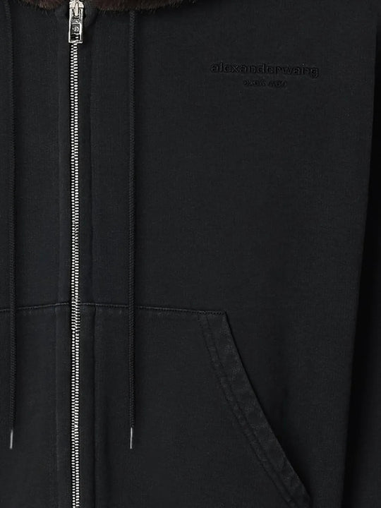 Close up of Black hoodie, showing texture of the 100% cotton fabric