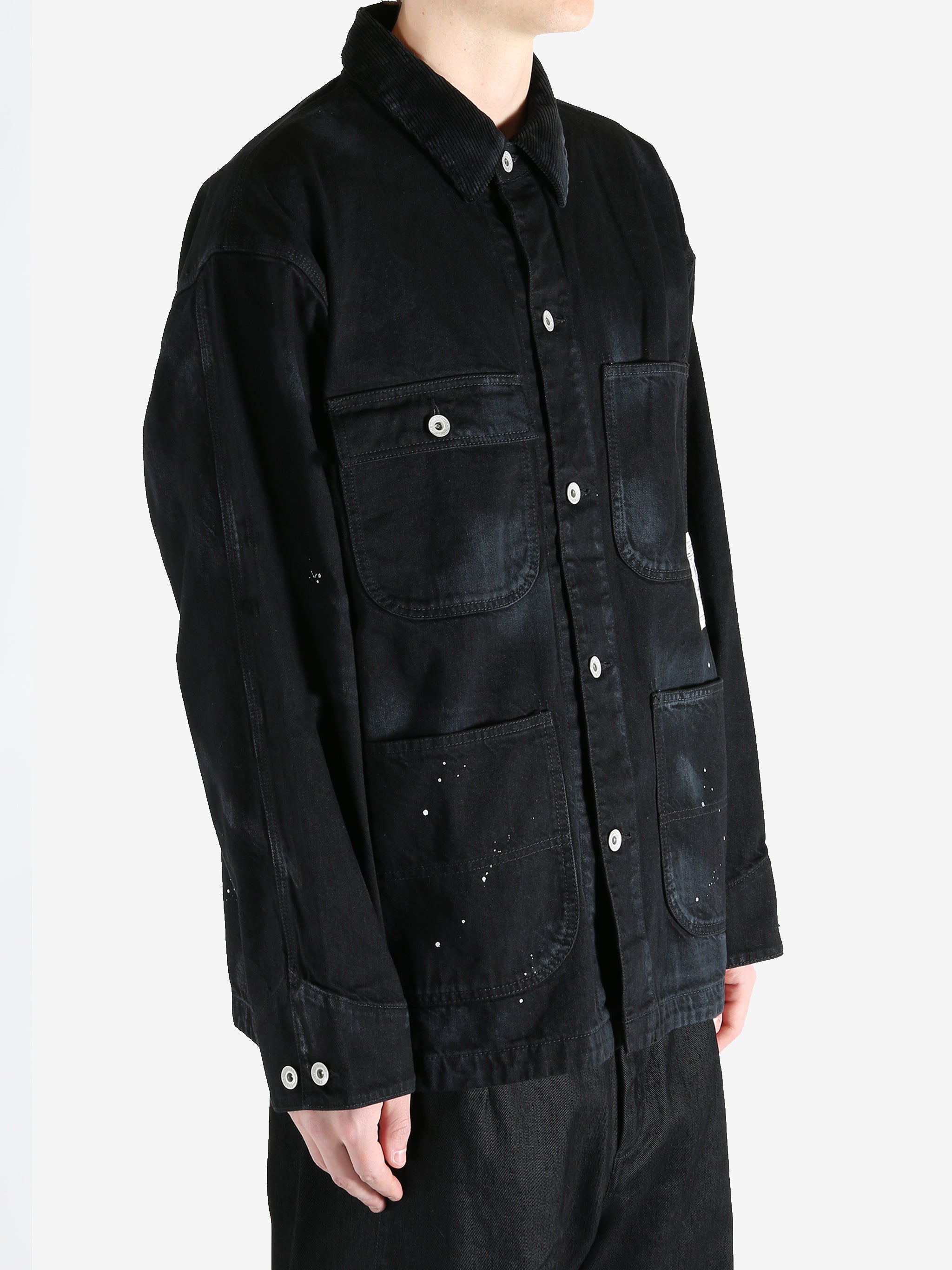 Black jackets worn by a person, showing the jackets fit