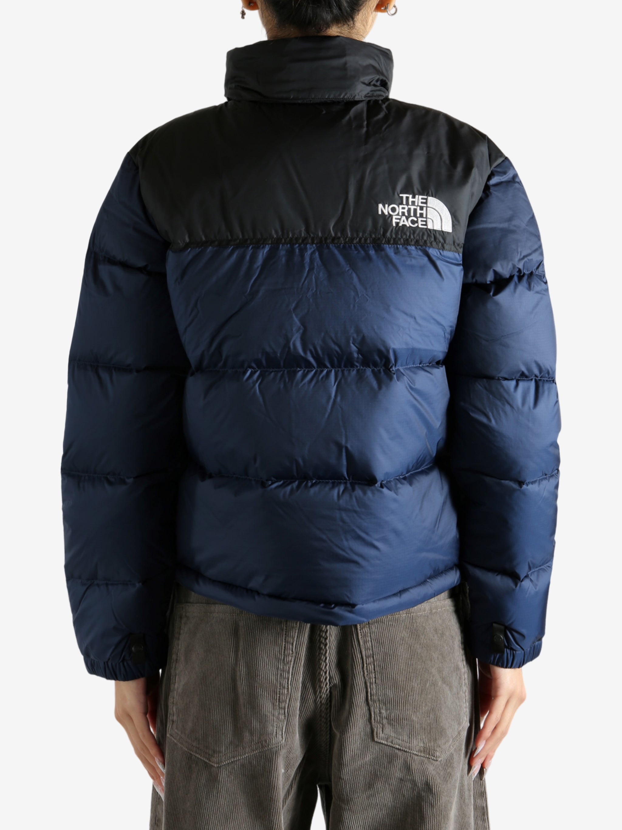 Navy jacket worn by a person, showing the jacket fit