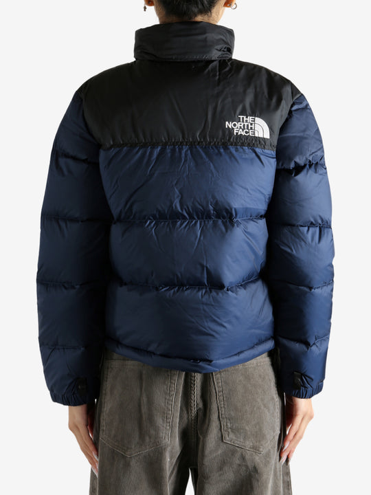 Navy jacket worn by a person, showing the jacket fit