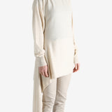 White top worn by a person, showing the top's fit