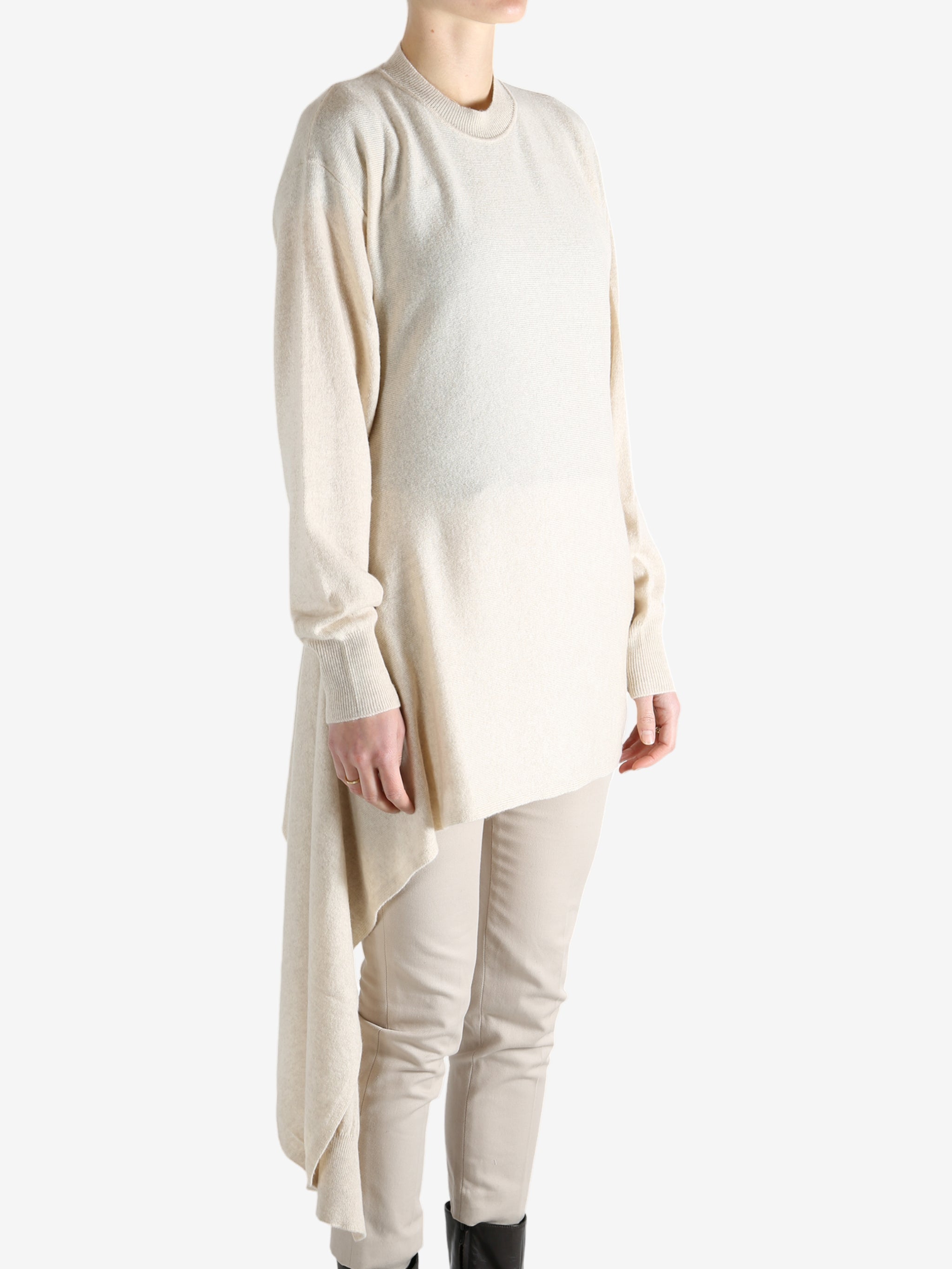 White top worn by a person, showing the top's fit