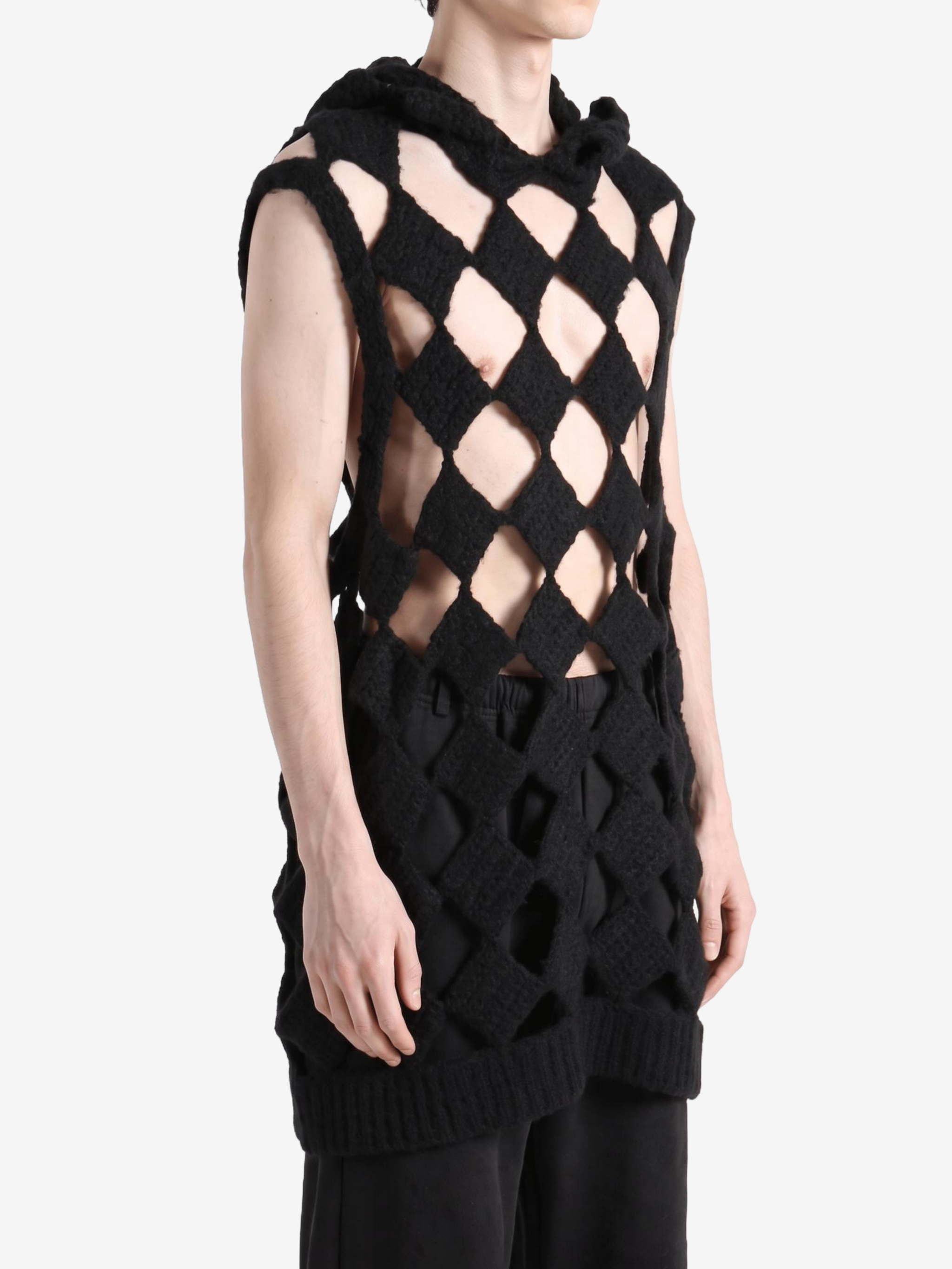 Black top worn by a person, showing the top fit