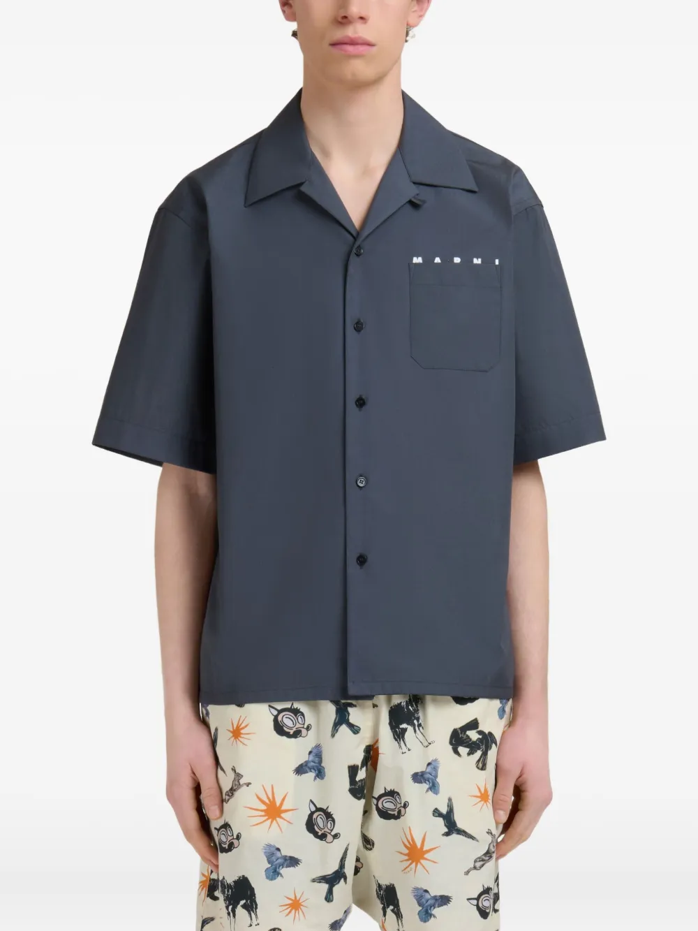 Blue shirt worn by a person, showing the shirt fit