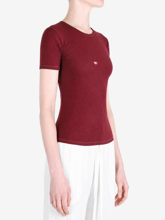 Burgundy t-shirt worn by a person, showing the t-shirt fit