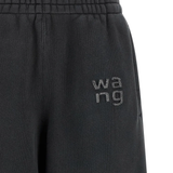 Close up of black pants, showing texture of the Logo rhinestones