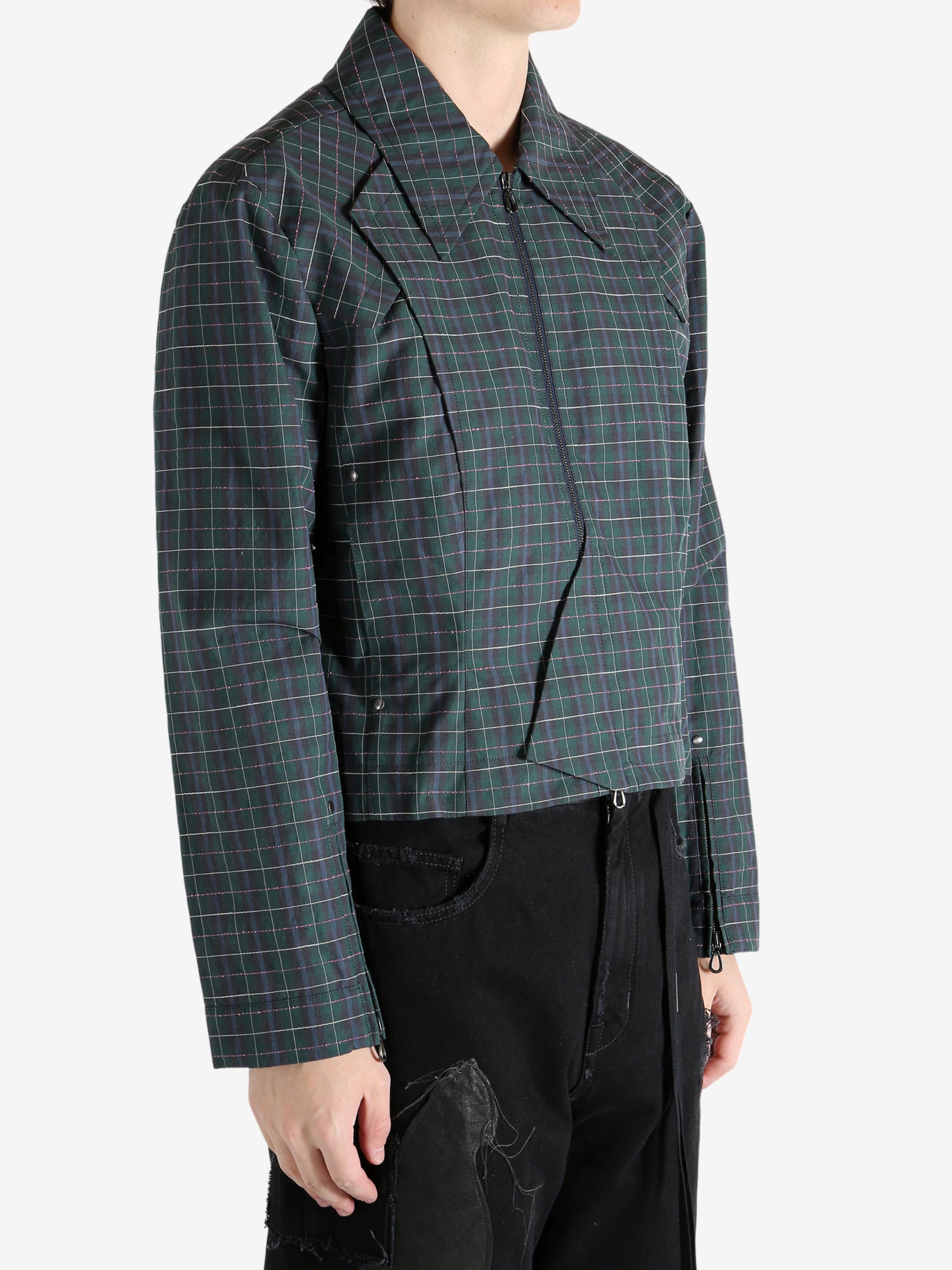 Green blouson worn by a person, showing the blouson's fit