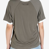 Grey tee worn by a person, showing the 
 tee's fit