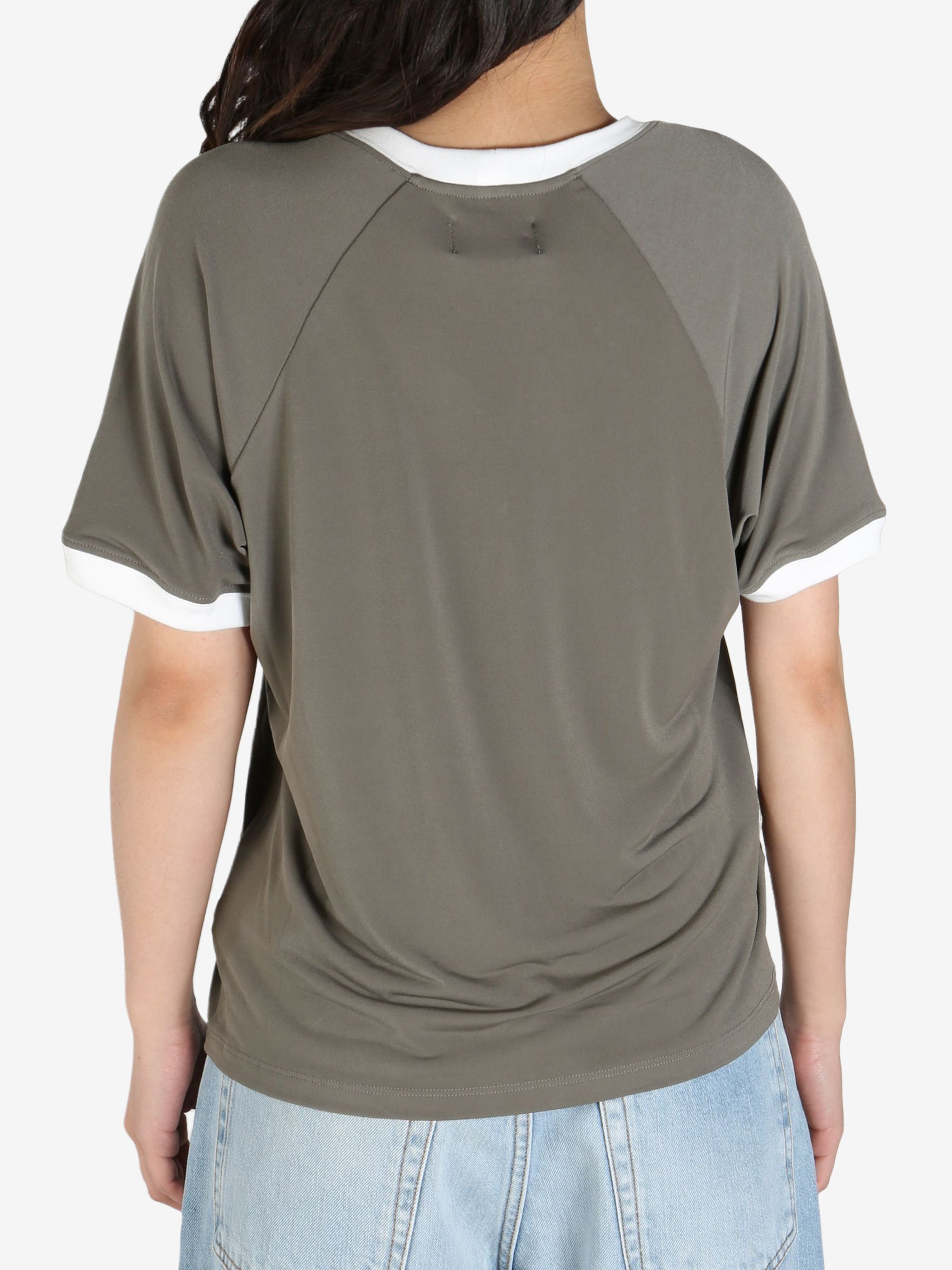 Grey tee worn by a person, showing the 
 tee's fit