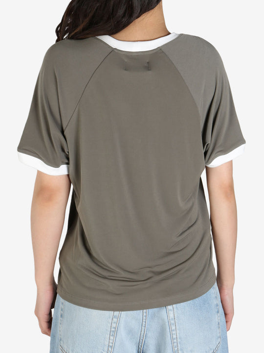 Grey tee worn by a person, showing the 
 tee's fit