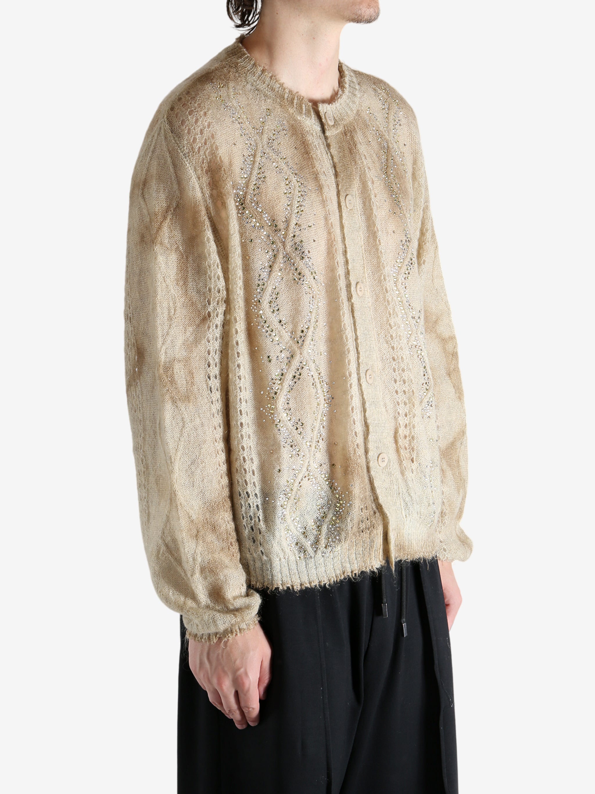 Tan knitwear worn by a person, showing the knitwear's fit